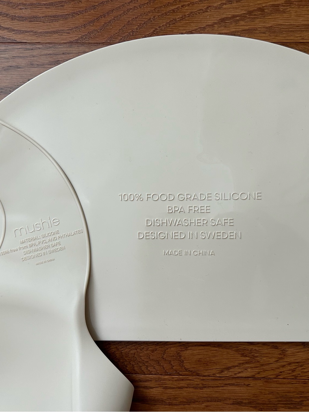 Mushie Dinosaur Print Silicone Bib/Matching Placemat And Aeiou Divided Plate Set — image 3 of 4